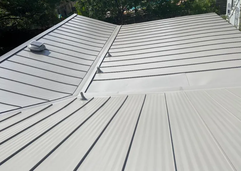 Solar attic fan installed on a metal roof for Roof Ventilation in California